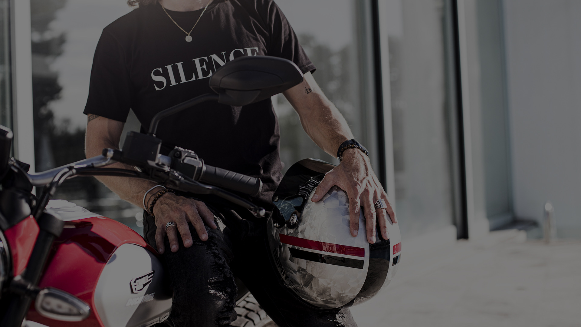 Rider holding a helmet