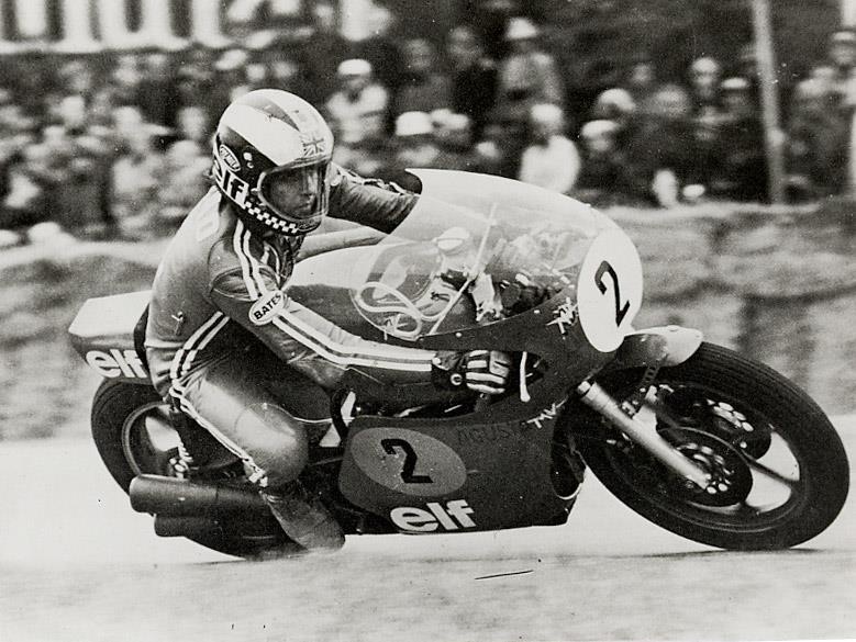 A rider racing, black and white archive photograph